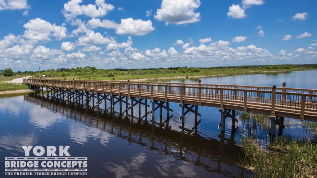 Ave Maria University Pedestrian Bridge - Ave Maria, FL | York Bridge Concepts - Timber Bridge Builders