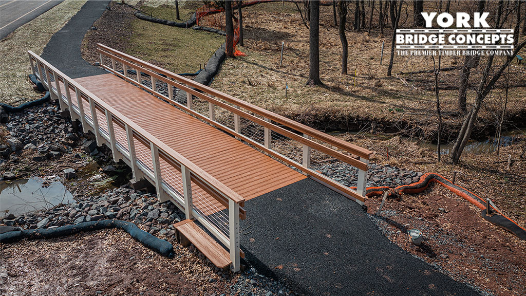 top and side view details Rail and deck details Meadowood memory care center pedestrian timber bridge.