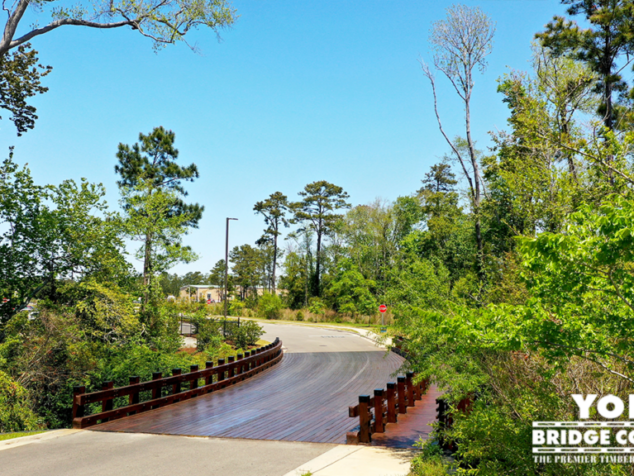 Ocean Isle Multiple Span with Glulaminated Stringers. Over Wetland. Ocean Isle Decero Design Classic Series Timber Bridge