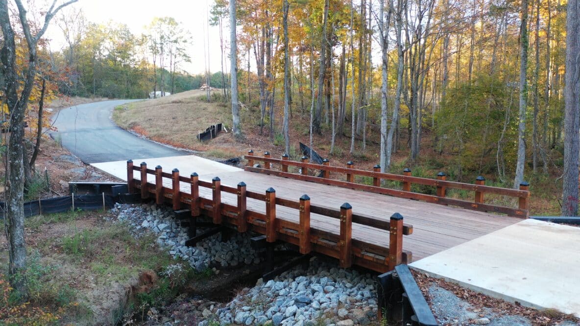 Serenbe Prom Field Road Timber Vehicular Bridge in Chattahoochie Hills, GA angled overhead picture