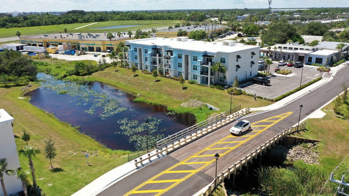 The York Bridge Concepts' project: Reserve At Jensen Beach double lane vehicular timber bridge with attached pedestrian walkway in Jensen Beach, FL