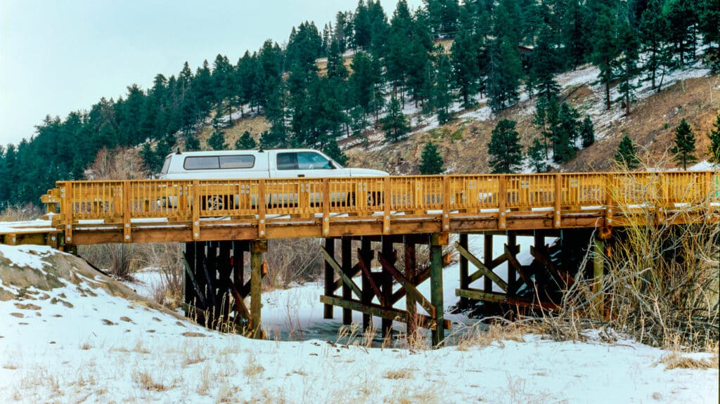 Flying J Ranch timber vehicular bridge span by York Bridge Concepts in Evergreen, CO