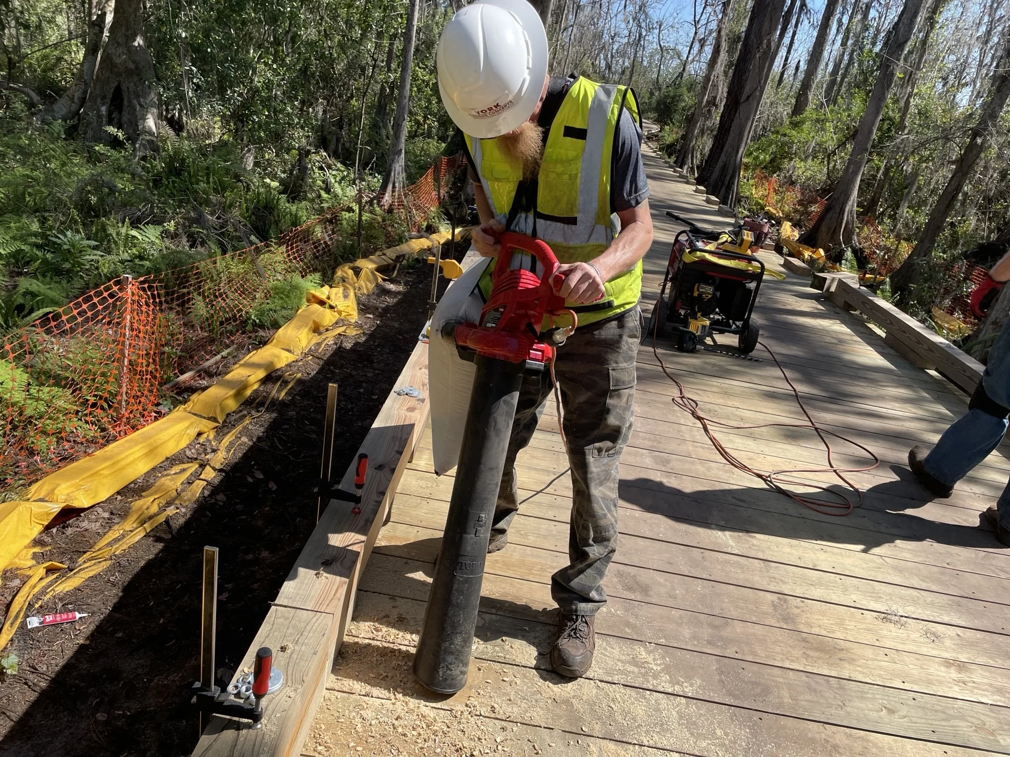 YBC Construction techniques- vacuuming up wood shavings